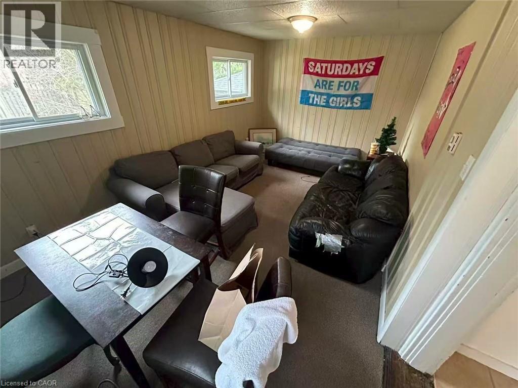 A living room with a sign that says "Saturdays are for the girls".