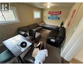 A living room with a sign that says "Saturdays are for the girls".