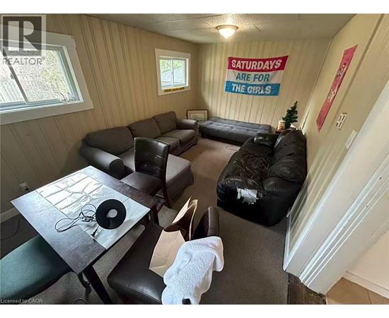 A living room with a sign that says "Saturdays are for the girls".