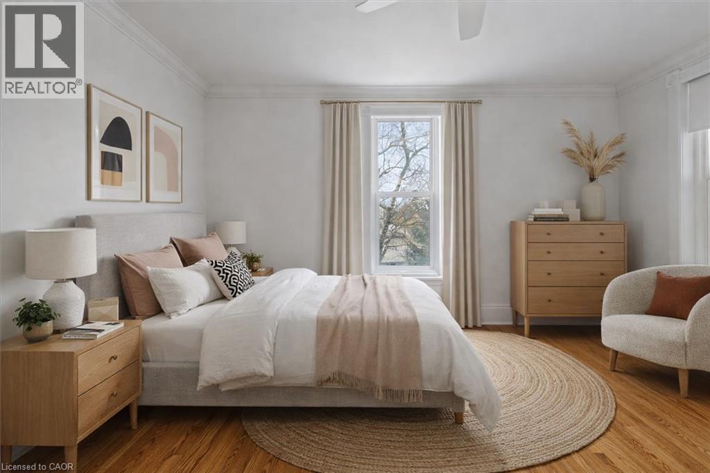 A bedroom with a bed, a chair, and a dresser.