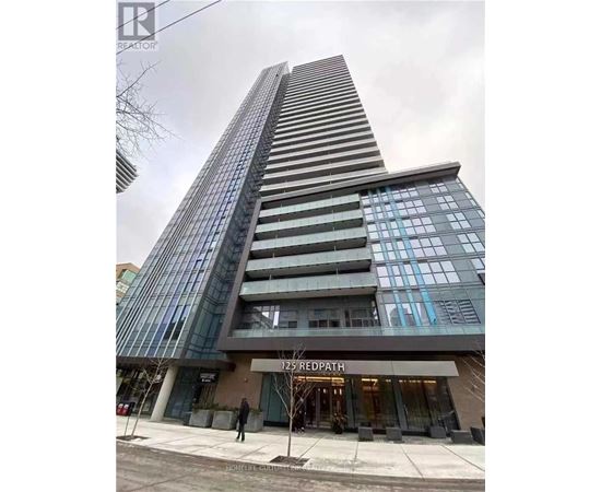 A tall building with a glass facade and a sign that reads "125 REDPATH" in front of it.