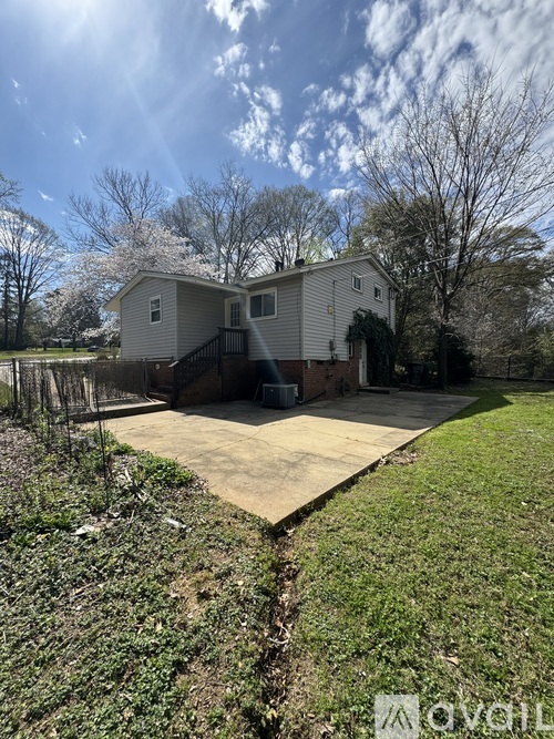 A house with a driveway in front of it.