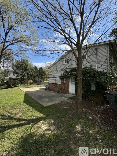 A house with a tree in front of it.