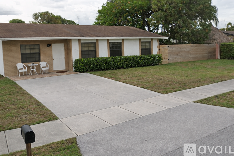 A house with a white door and a small porch.