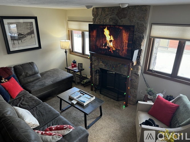 A living room with a fireplace and a couch.
