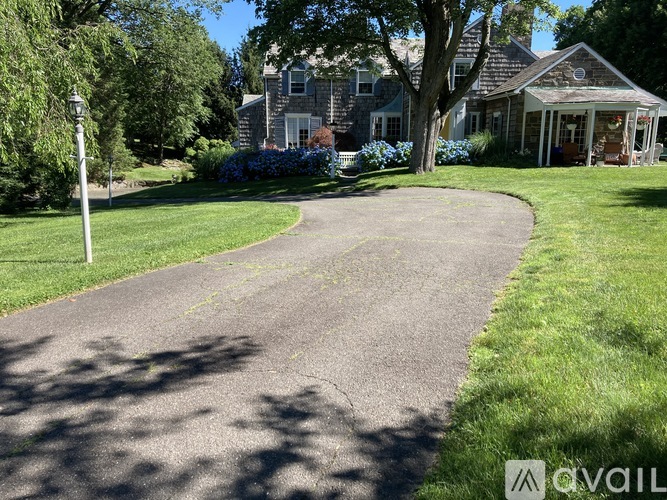 A residential area with a curved road and houses.