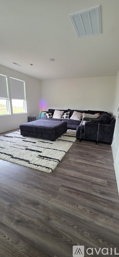 A bedroom with a bed and a couch.