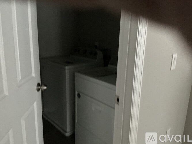A small white bathroom with a toilet and sink.