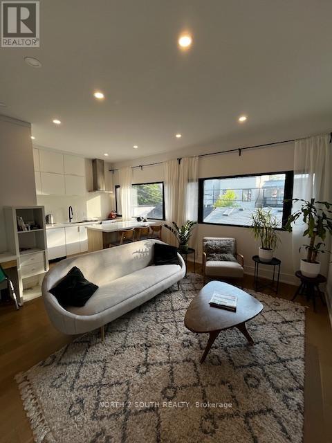 A modern living room with a large sofa and a coffee table.
