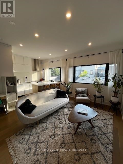 A modern living room with a large sofa and a coffee table.