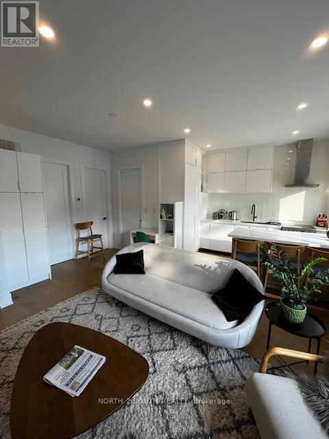 A living room with a grey sofa and a coffee table.