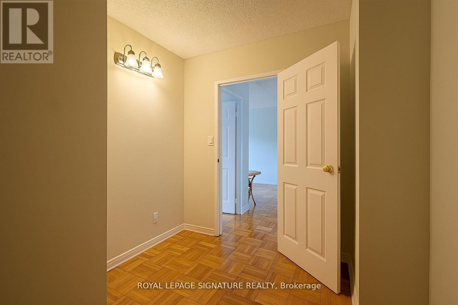 A room with a door and a chair in it.
