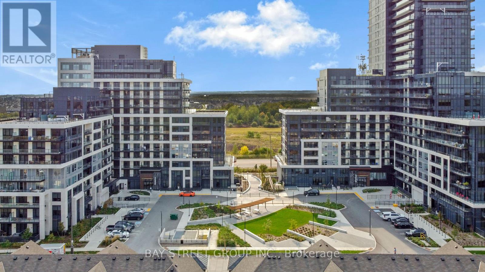 A realtor brokerage office is located in a large, modern building complex.