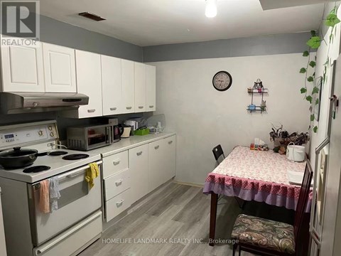 A small kitchen with a table and chairs.