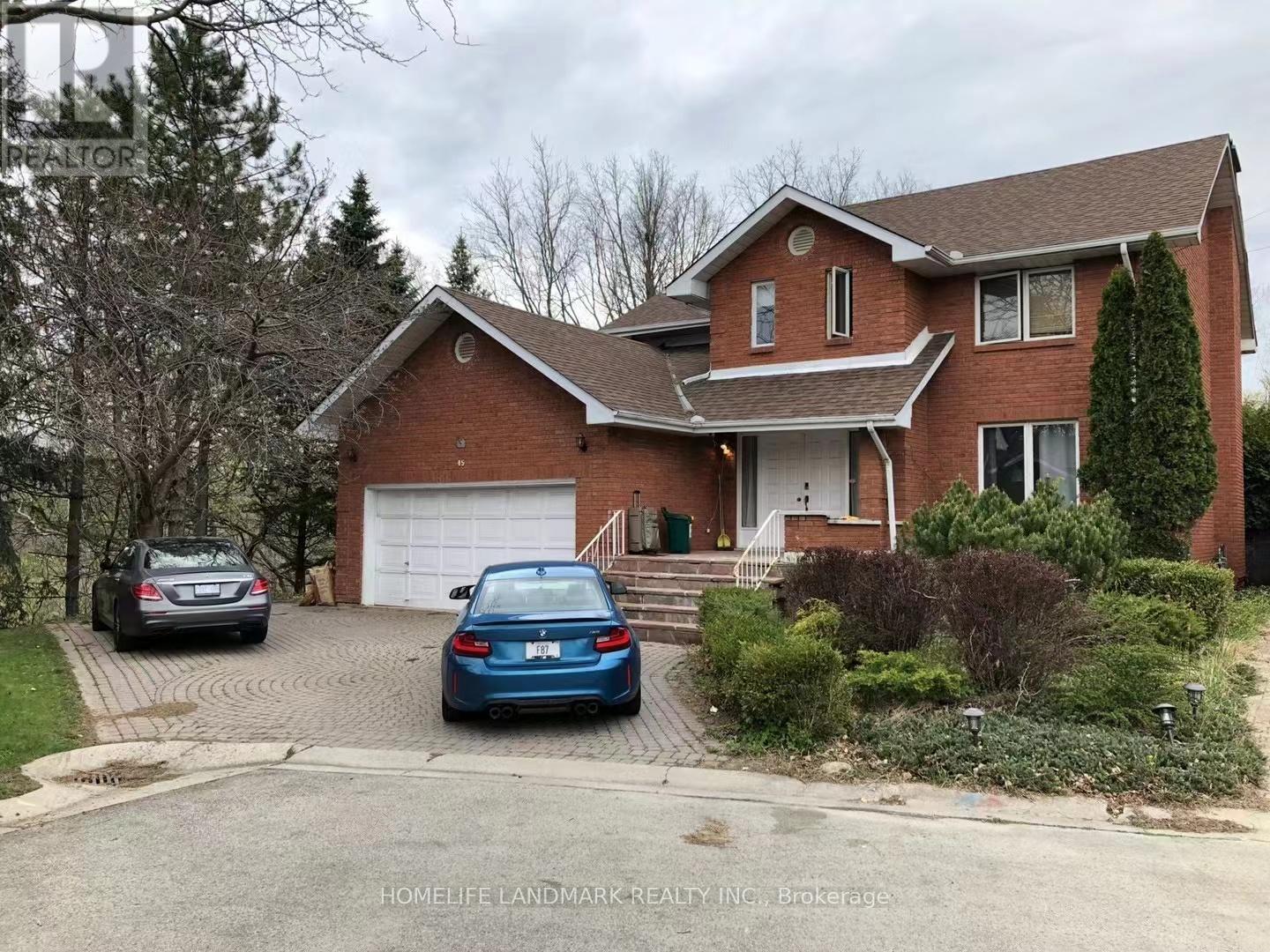 A house with a car parked in front of it.