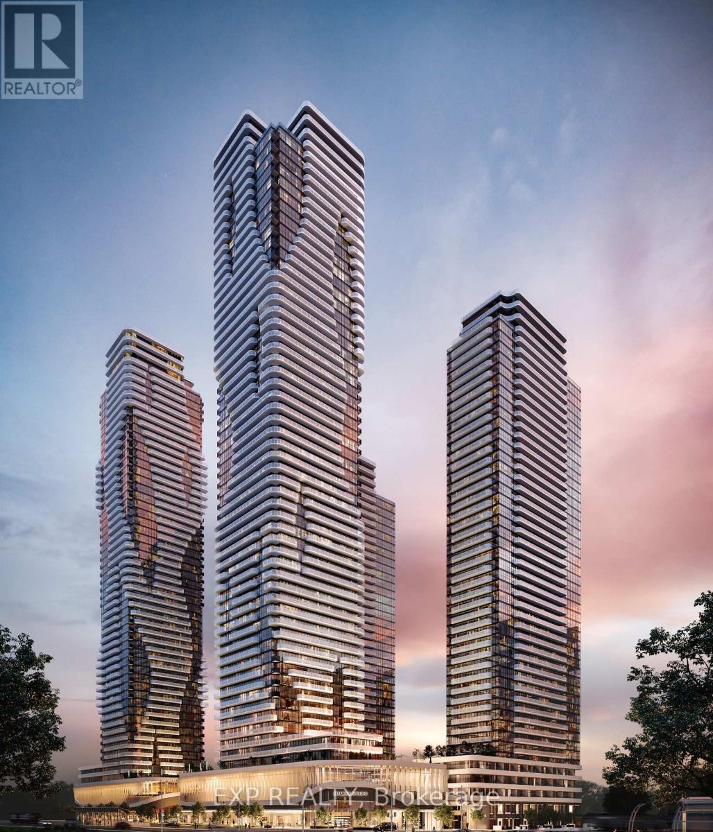 Three tall buildings with a glass facade are shown in the image.