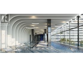 A modern indoor swimming pool area with a glass wall on one side.