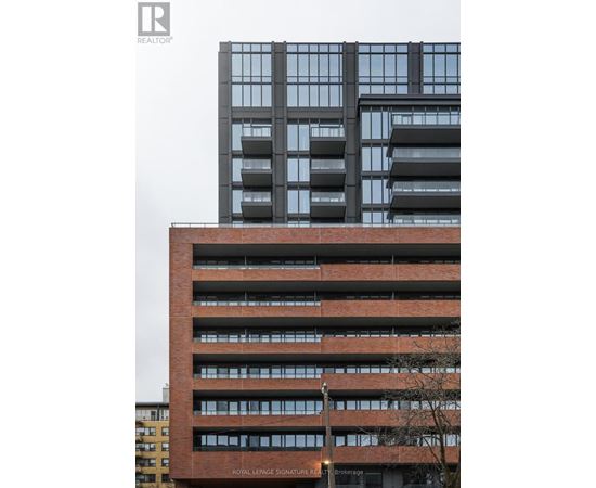A tall building with a sign that says "Royal LePage Signature Real Estate Brokerage".