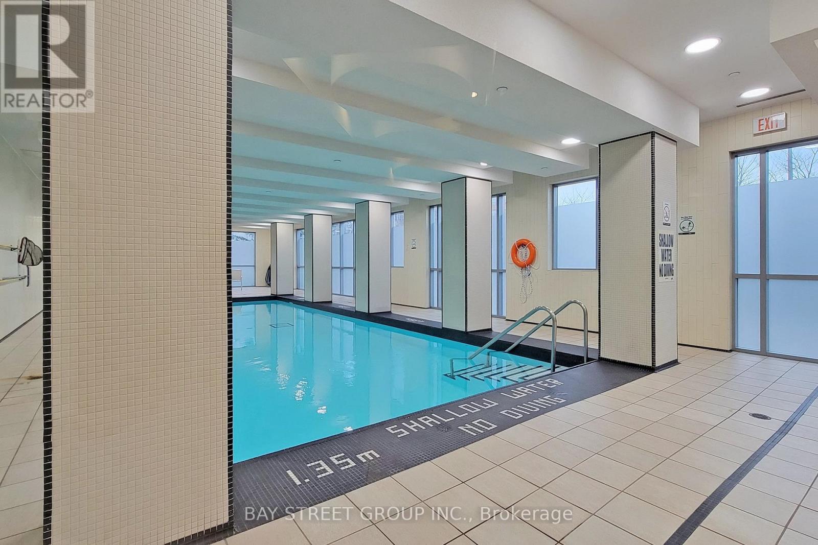 A large indoor swimming pool with the text "1.35m SHOOTING BALL START" on the bottom.