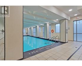 A large indoor swimming pool with the text "1.35m SHOOTING BALL START" on the bottom.