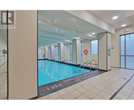 A large indoor swimming pool with the text "1.35m SHOOTING BALL START" on the bottom.