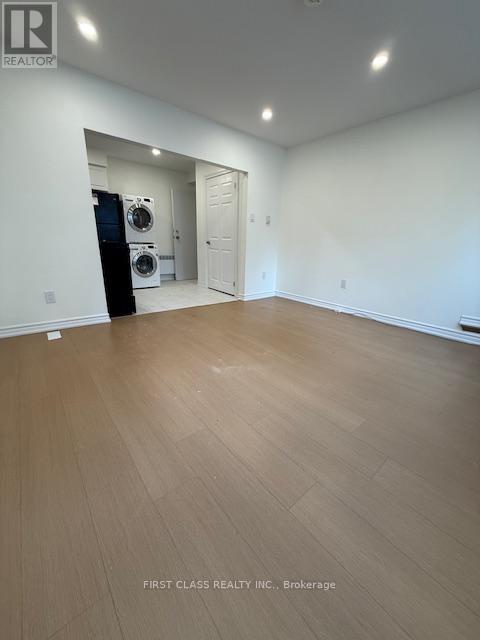 A room with a washer and dryer in it.