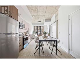 A modern kitchen with a dining table and chairs.
