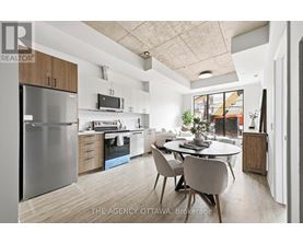 A modern kitchen with a dining table and chairs.