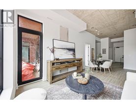 A modern living room with a coffee table in the center.