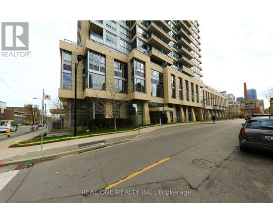 A street view of a building with the logo REAL ONE REALTY INC., Brokerage on the bottom right.