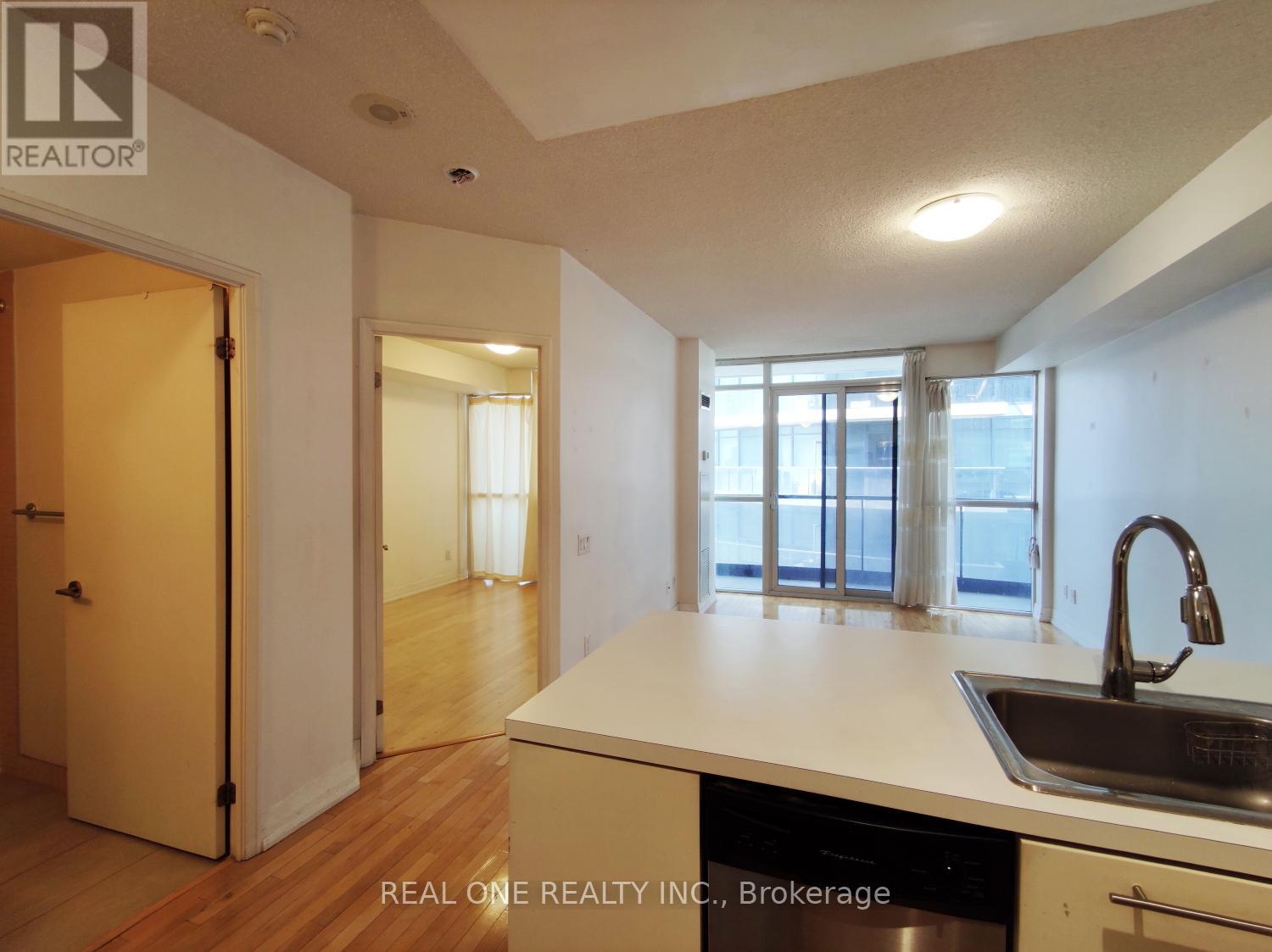 A kitchen with a sink and a window.