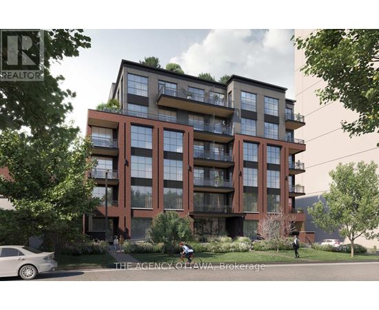 A modern apartment building with balconies and greenery on the roof.