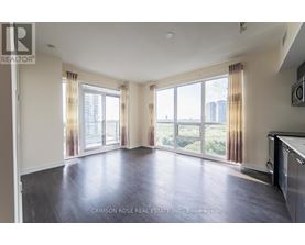 A spacious living room with a view of the city.