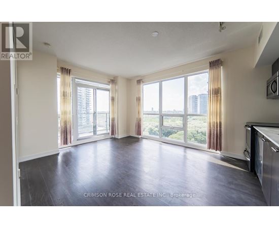 A spacious living room with a view of the city.