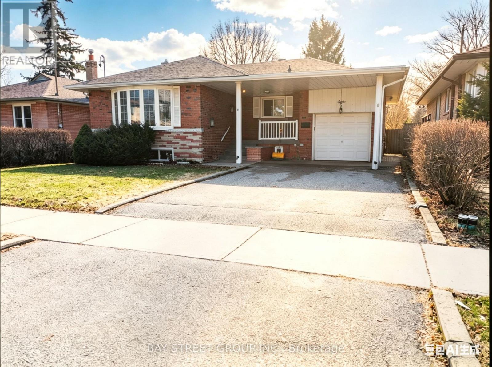 A house with a garage and a driveway in front.