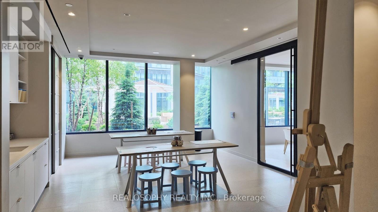 A dining area with a table and chairs is shown in the image.
