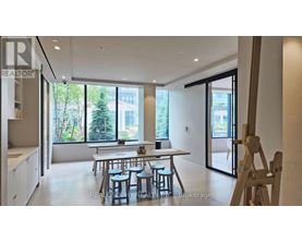 A dining area with a table and chairs is shown in the image.