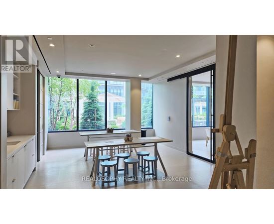 A dining area with a table and chairs is shown in the image.