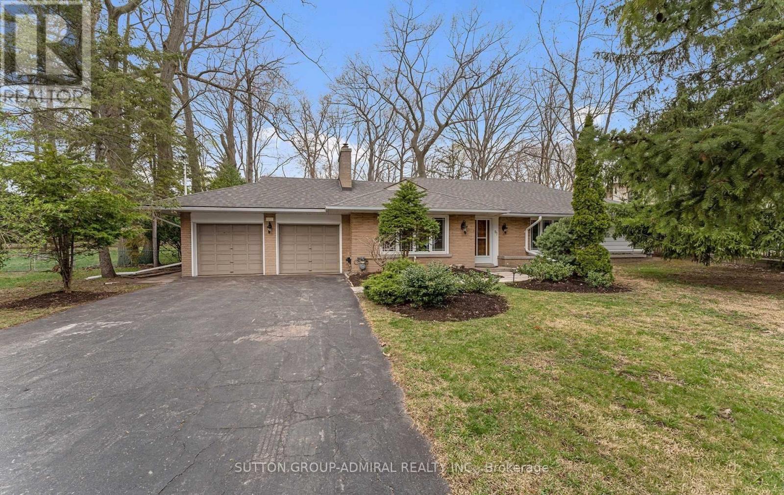 A residential house with a driveway and a garage.