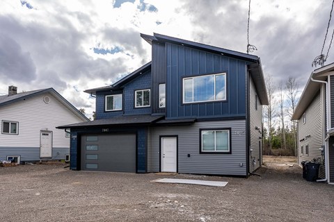 A modern house with a garage and a driveway.