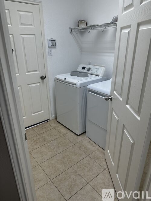 A small, white bathroom with a toilet and sink.
