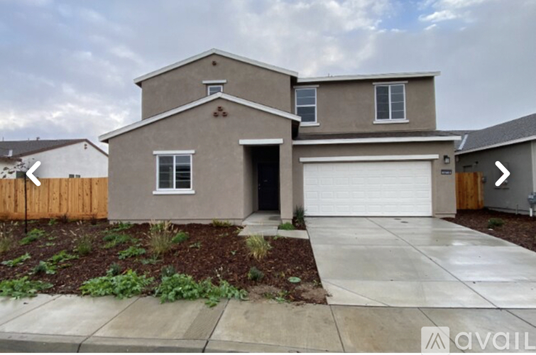 A house with a garage is available for sale.