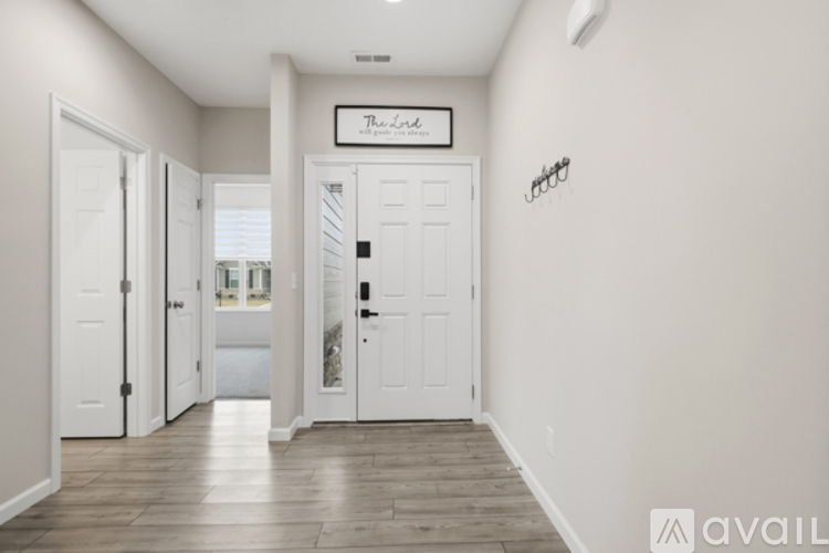 A hallway with a sign that says "The Lodge" on it.