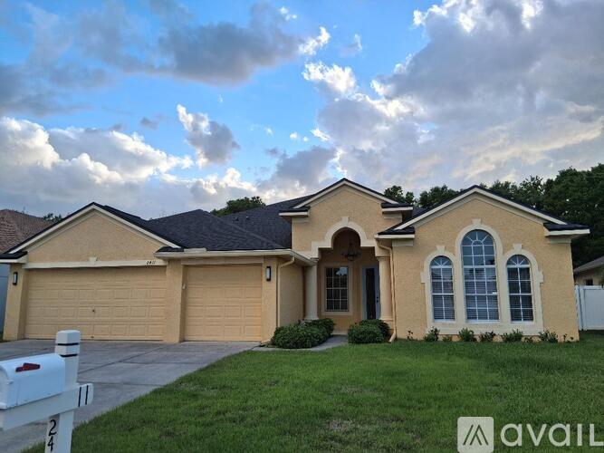 A house with a white mailbox numbered 1124 is for sale.