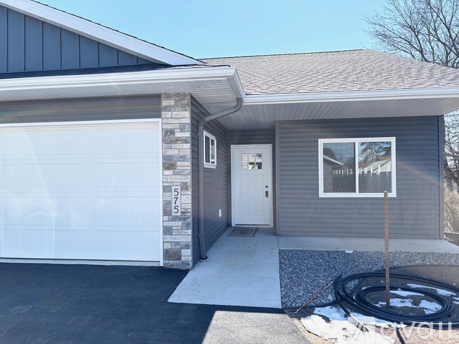 A house with a garage and a driveway.