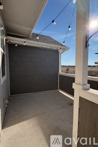 A sunny day with a garage door open.