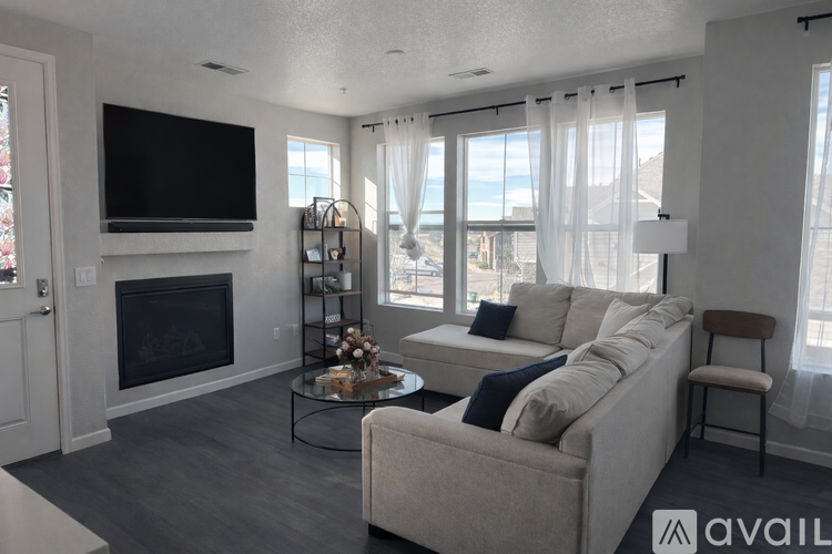 A living room with a fireplace and a couch.