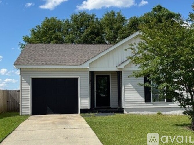 A two-car garage with a white exterior and a brown roof.