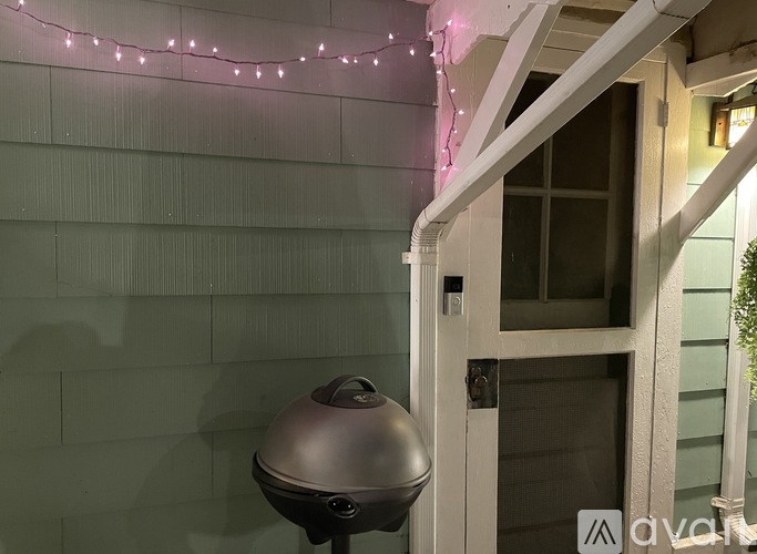 A black satellite dish is on a patio.