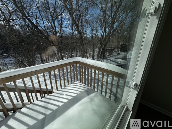A view from a balcony looking out at a snowy landscape.